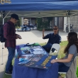 Club Advisor Travis Smith and Kayleigh Pontiff talk to a student