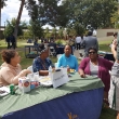 Valerie Harris and Students from Umoja and the Black Student Union enjoy Flavors fries while talking to a student about their club.