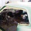 Brandon Delong masking inside of the Mustang